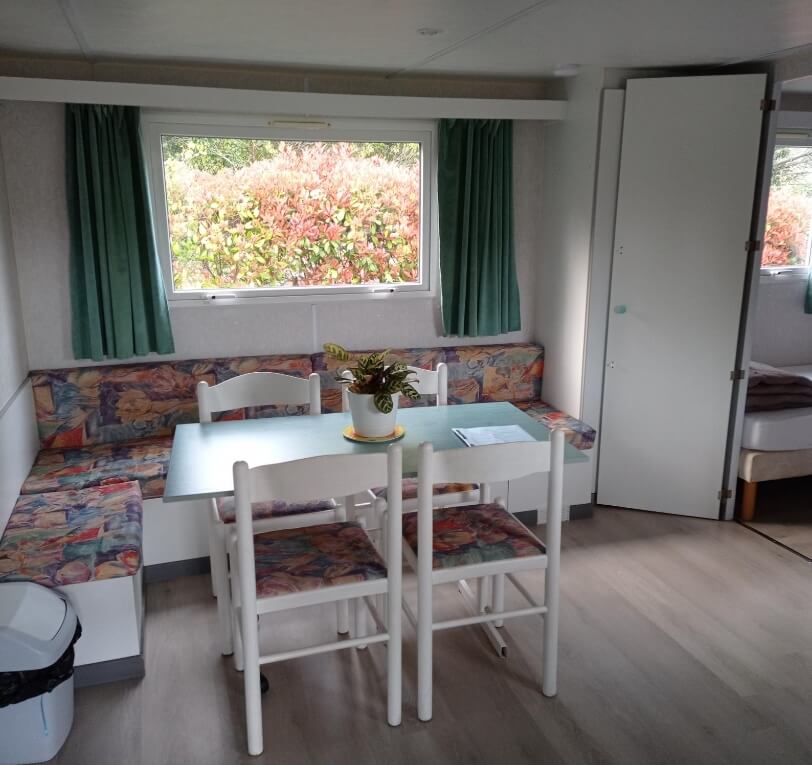 Living area, Le Laurier and Le Palmier mobile homes available to rent at Le Bel Air campsite in the Lot