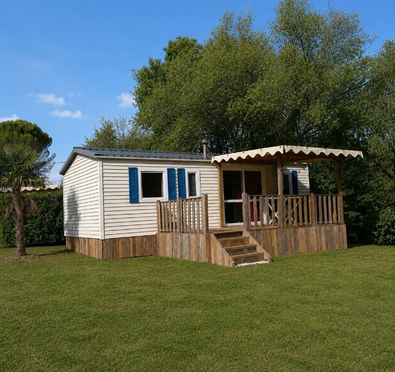 Exterior view of the ‘Le Figuier’ mobile homes available for hire at Le Bel Air campsite in the Lot