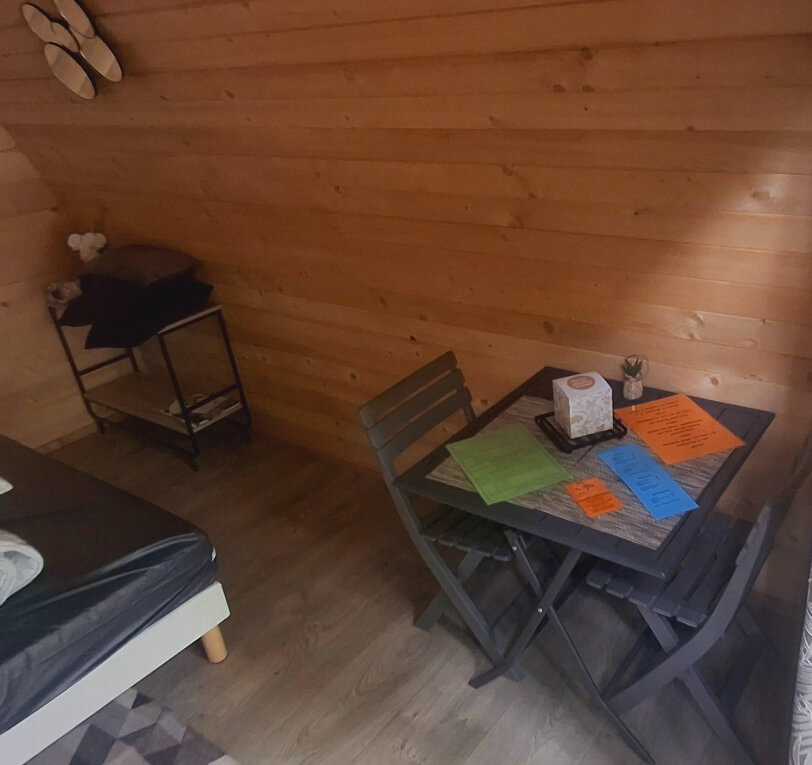 Wooden Pod dining area, unique accommodation in the Lot with a double bed, available to rent at Le Bel Air campsite in the Lot