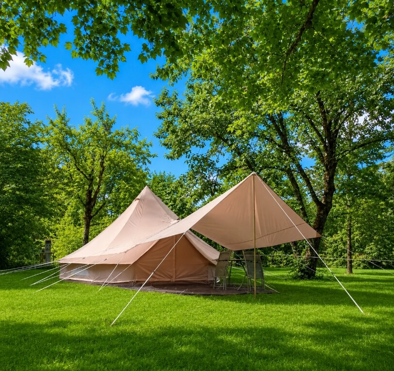 Exterior view of the Sibley tent, a unique accommodation option in the Lot, available to rent at Le Bel Air campsite in the Lot