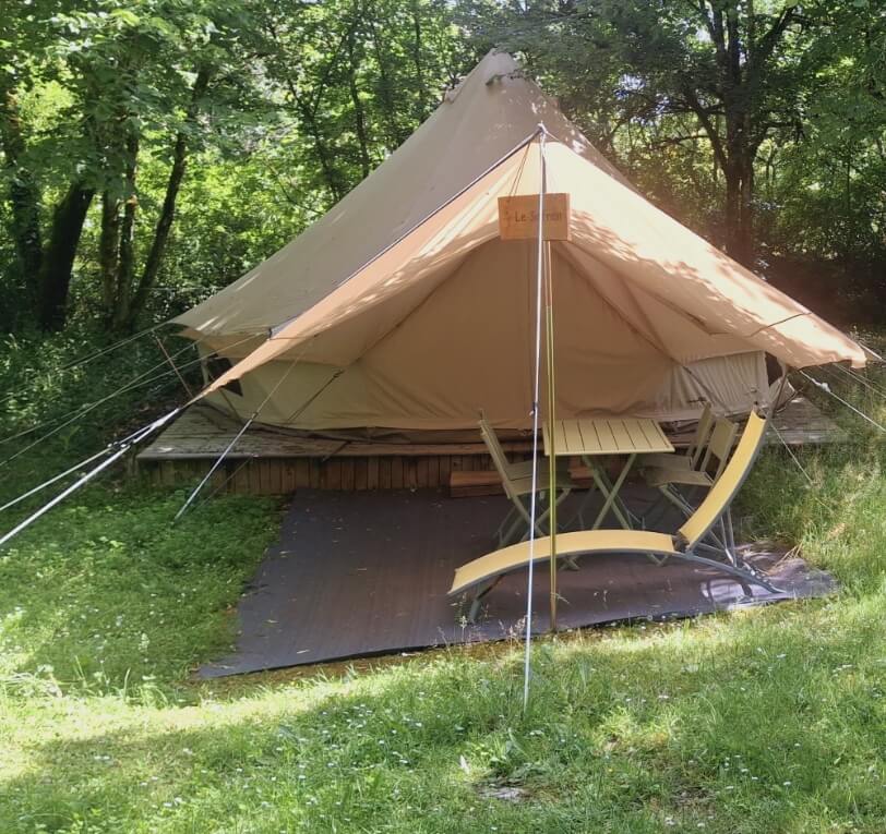 Interior view of the Sibley tent with two beds, unique accommodation in the Lot, available to rent at Le Bel Air campsite in the Lot